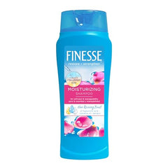 FINESSE shampoo being poured to reveal silky, manageable hair.