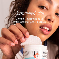 First Aid Beauty Facial Radiance Pads in hand for travel-friendly exfoliation