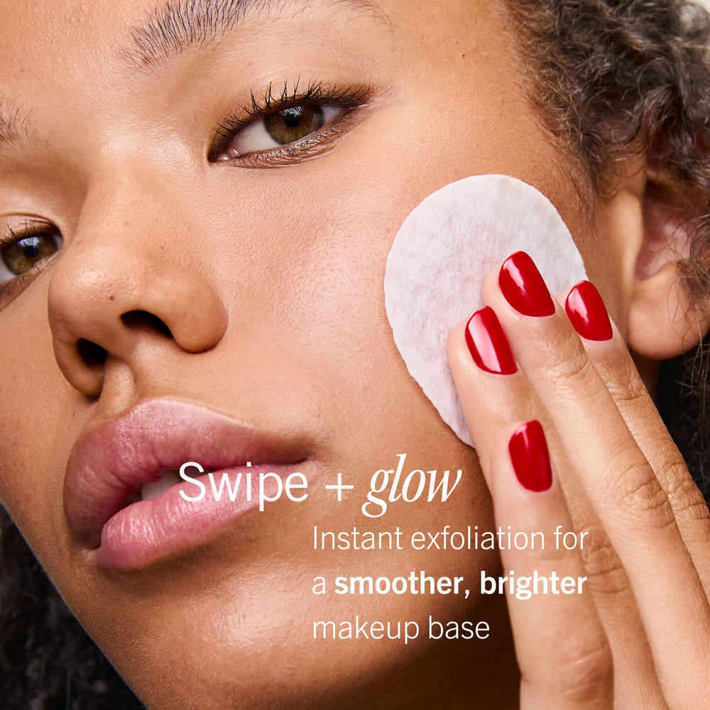First Aid Beauty facial radiance pads on hand illustrating compact size for travel-ready skincare.