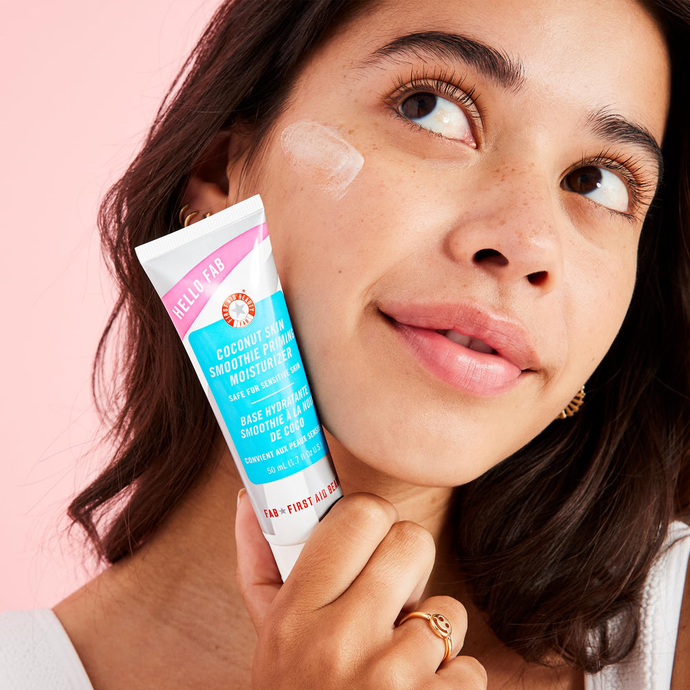 First Aid Beauty Hello FAB 2-in-1 formula demonstrated as makeup grip and moisturizer.