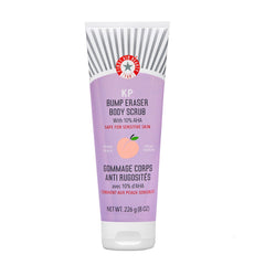 First Aid Beauty KP Bump Eraser jar closeup shows exfoliating texture for smoother skin.