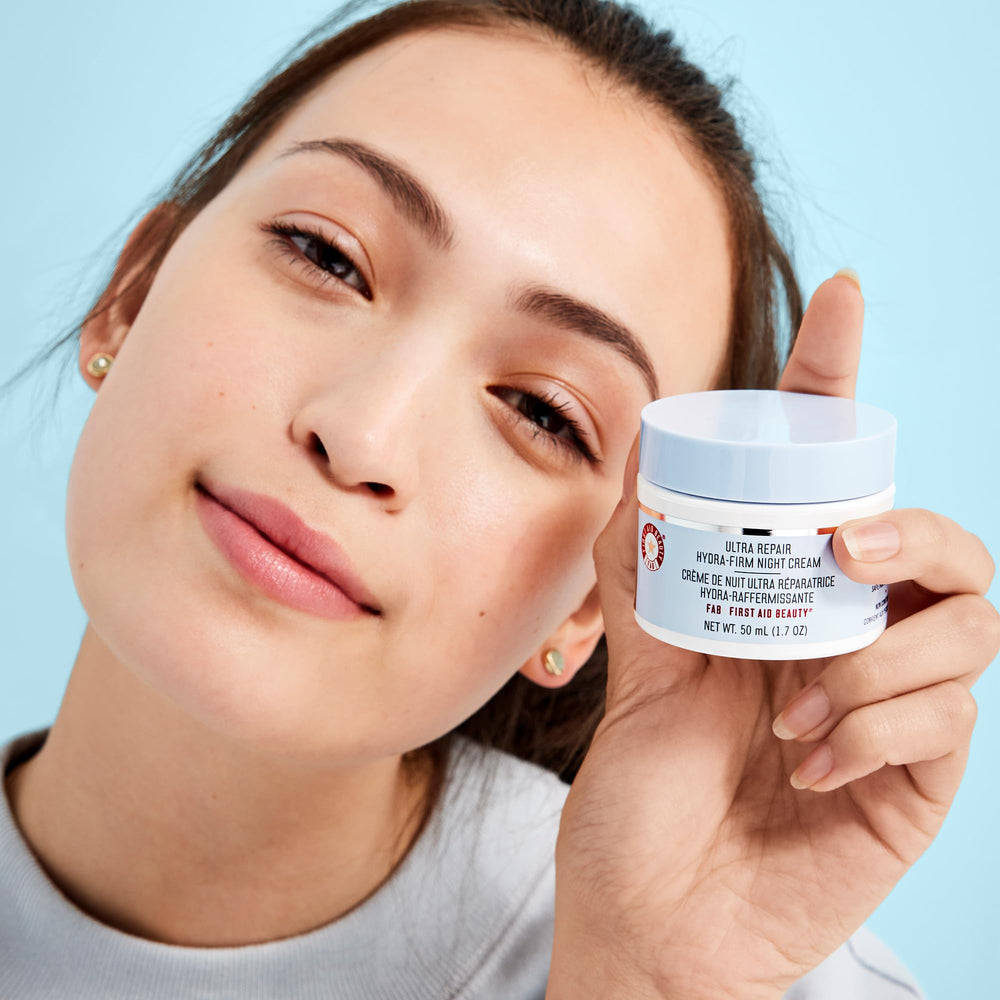 First Aid Beauty Ultra Repair Hydra-Firm Night Cream packaging display on shelf.