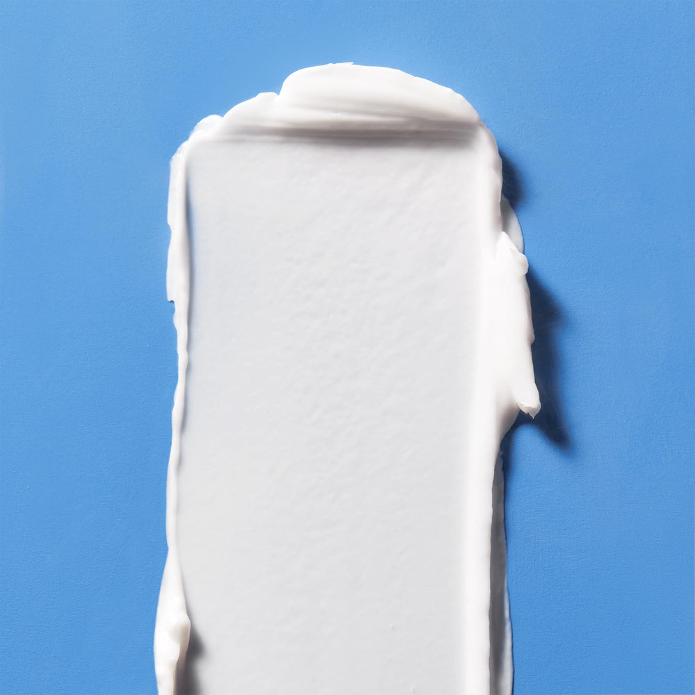 First Aid Beauty Ultra Repair Hydra-Firm Night Cream texture swirl highlighting luxurious moisture.