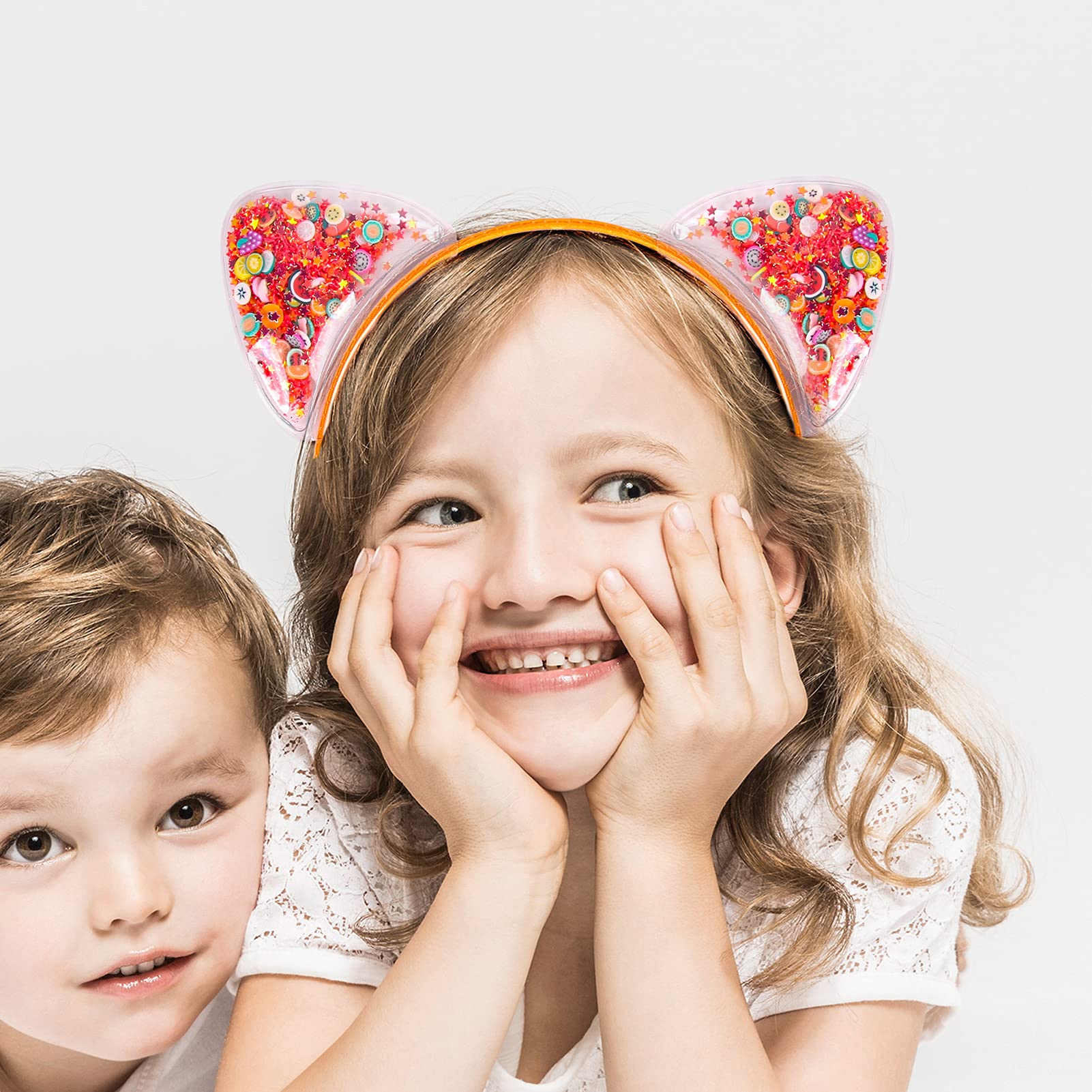 Fishdown pink headband with sequin stars for party-ready charm.