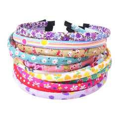 Fishdown headbands with floral cloth cover add gentle color to a girl's hair.
