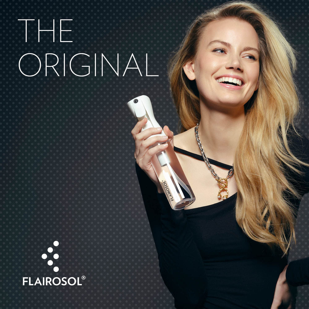FLAIROSOL clear bottle with black print showing fine atomization and design.