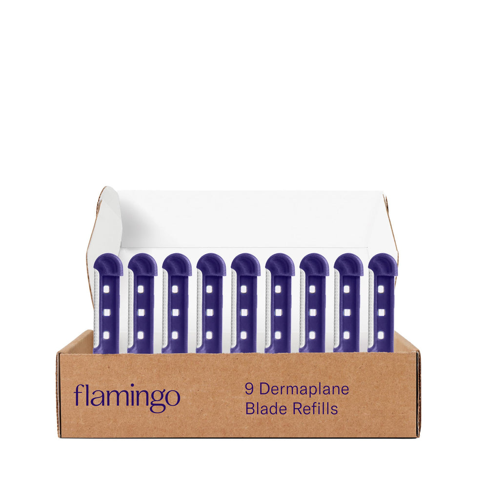 Flamingo Dermaplane blade refill close-up with stainless steel blades for precise exfoliation.