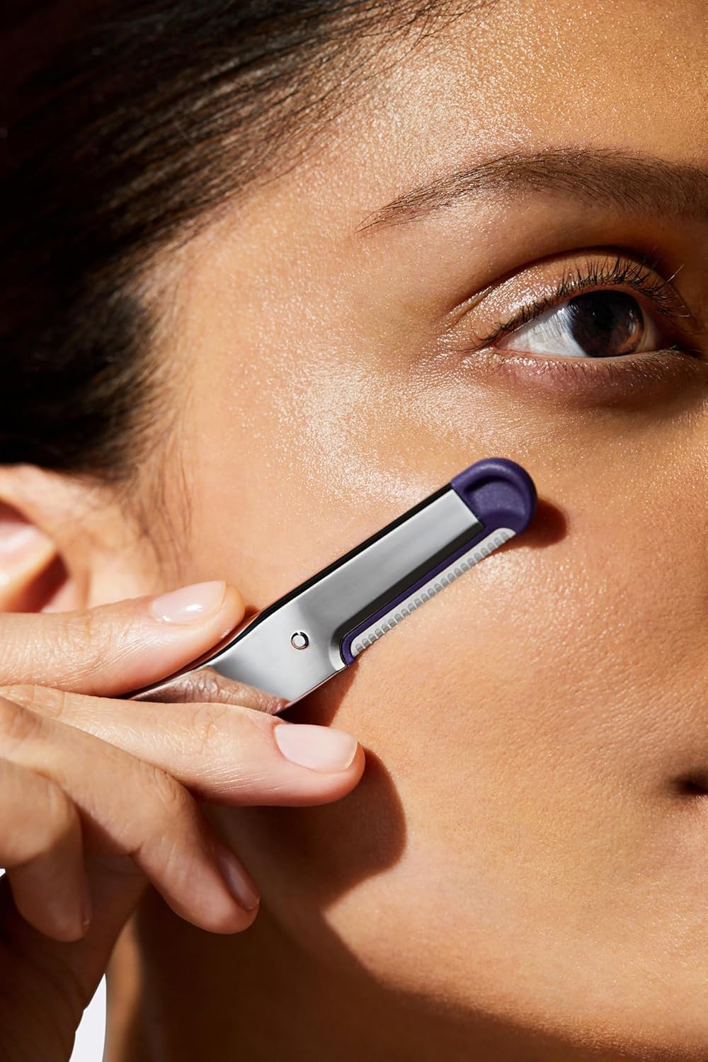 Flamingo Dermaplane blade performing gentle exfoliation for radiant skin.