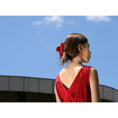 FlaSloth Cherry Red Claw Clip shows secure hold with spring