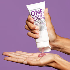 Applying Formula 10.0.6 face scrub to the face for even coverage.