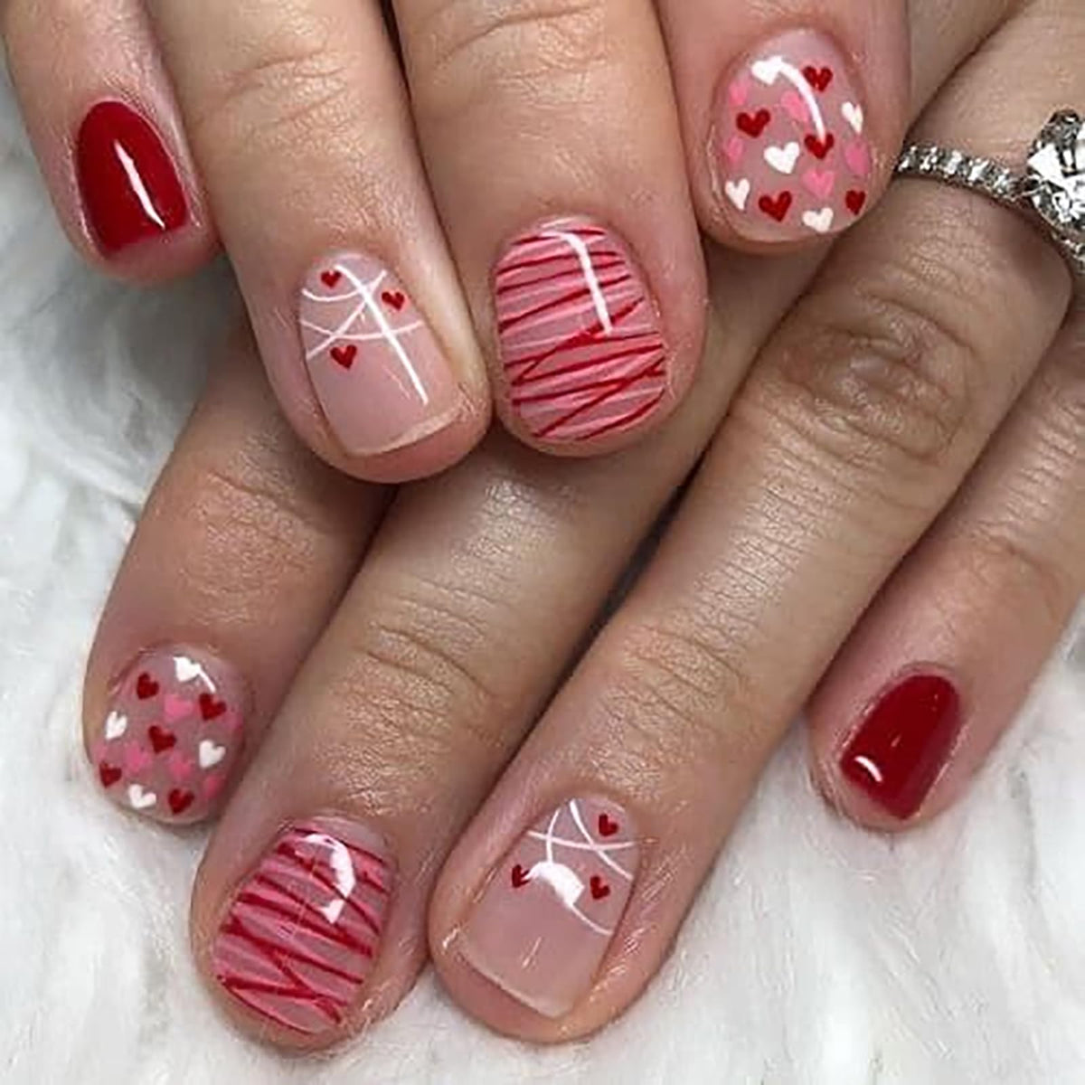 Foweso valentines nails with red heart design for quick DIY manicure.