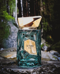 Fragrance World French Avenue Aether Extrait liquid hue, amberwood tones evident.