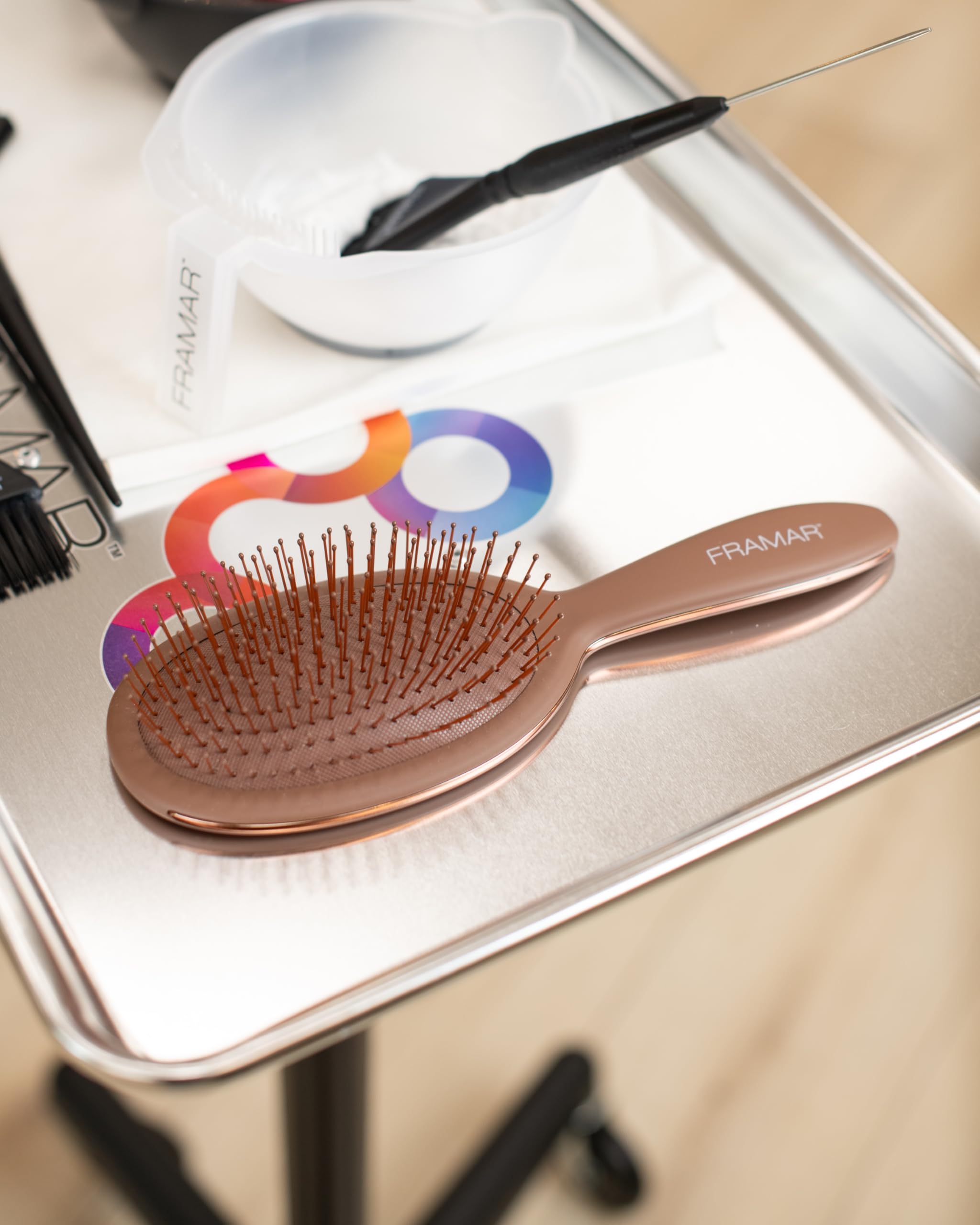 FRAMAR chocolate brush closeup shows flexible bristles for painless detangling