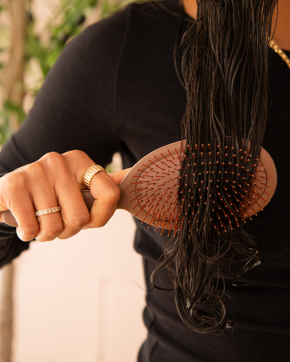 FRAMAR chocolate brush helps distribute conditioner through hair evenly