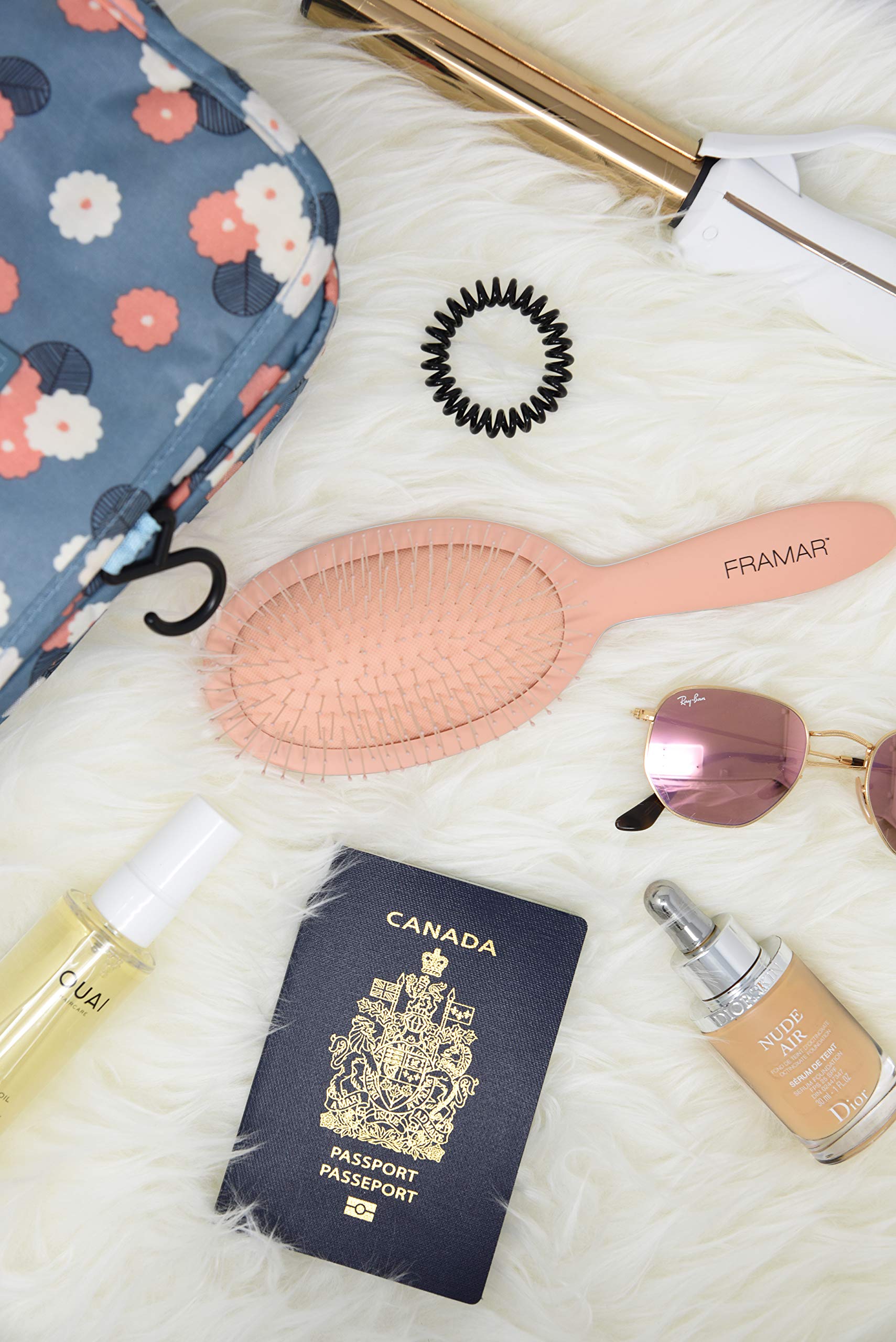 Framar Detangling Brush packed in a purse for on-the-go styling.