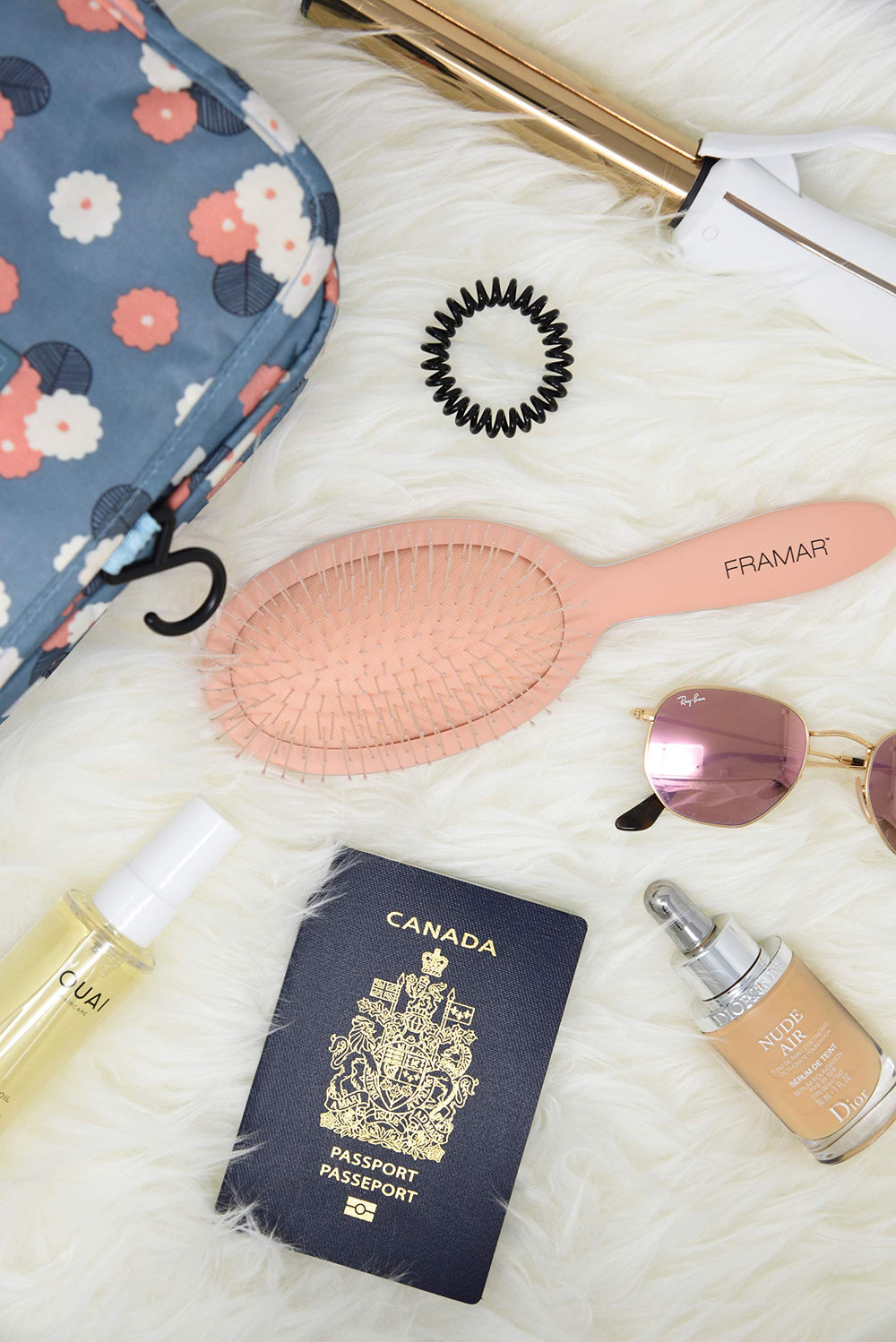 Framar Detangling Brush packed in a purse for on-the-go styling.
