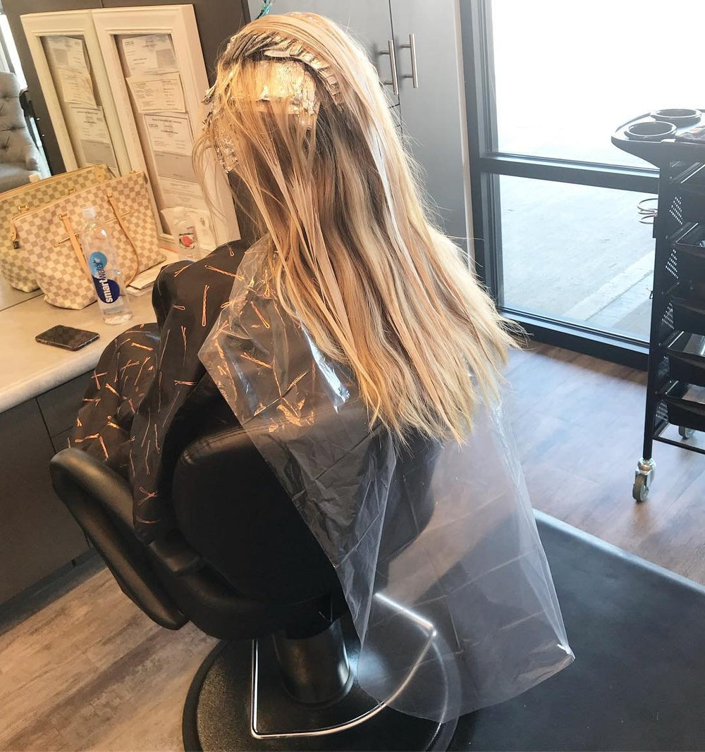 Framar hair dye cape is disposable for quick, mess-free color sessions.