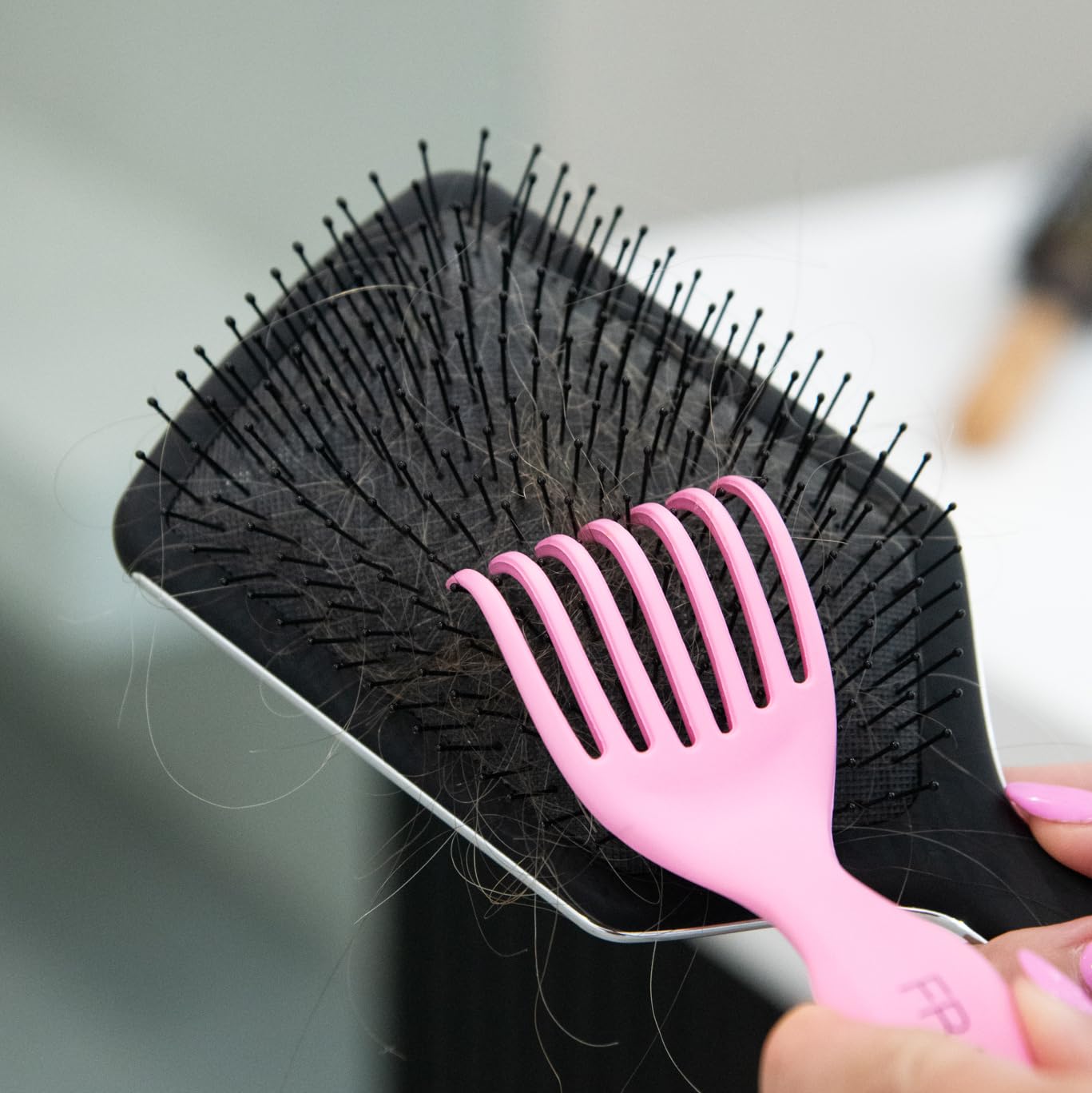 FRAMAR tool removes hair and residue quickly, keeping brushes ready to use.