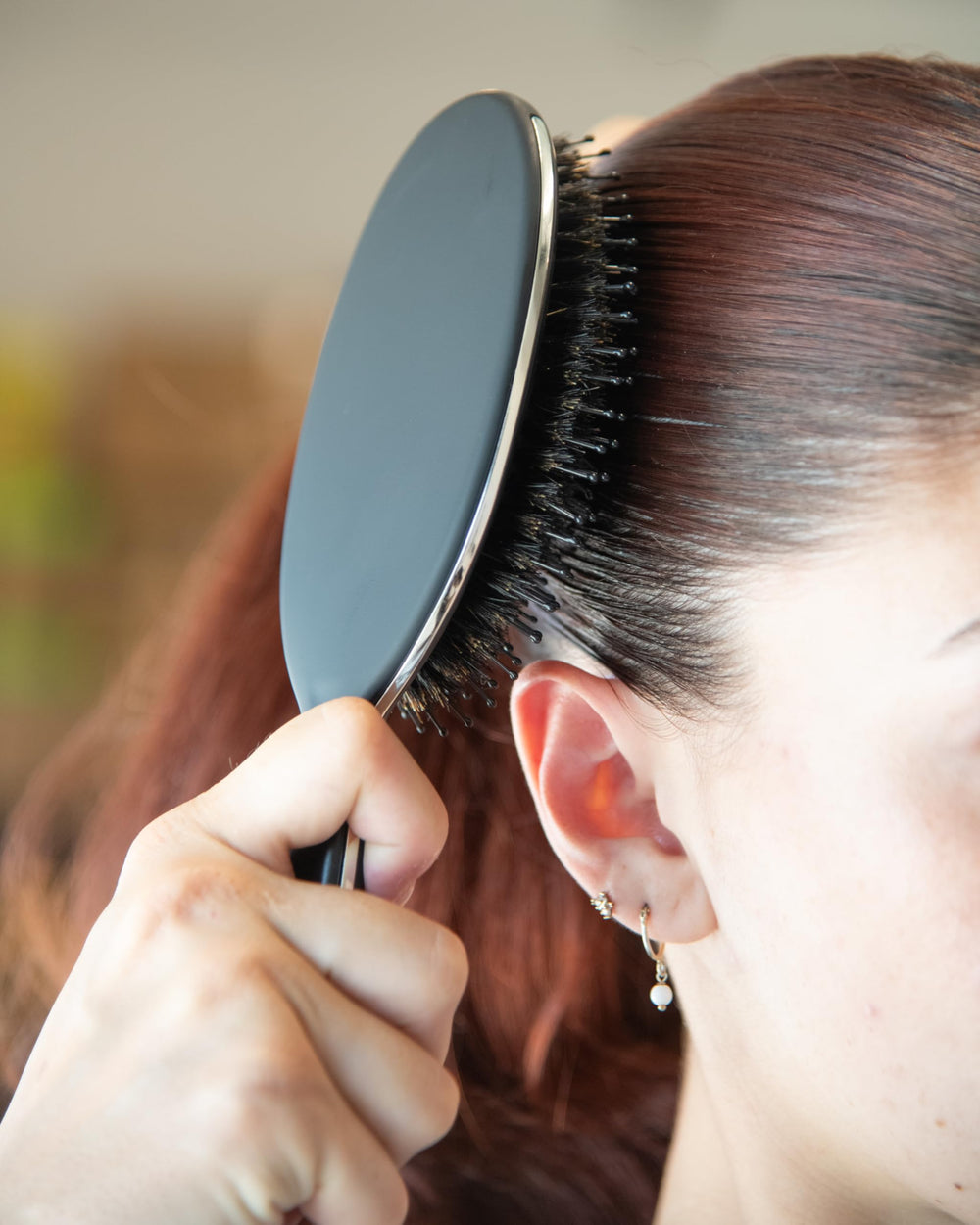 FRAMAR scalp-stimulation brush promotes healthy-looking scalp through light brushing