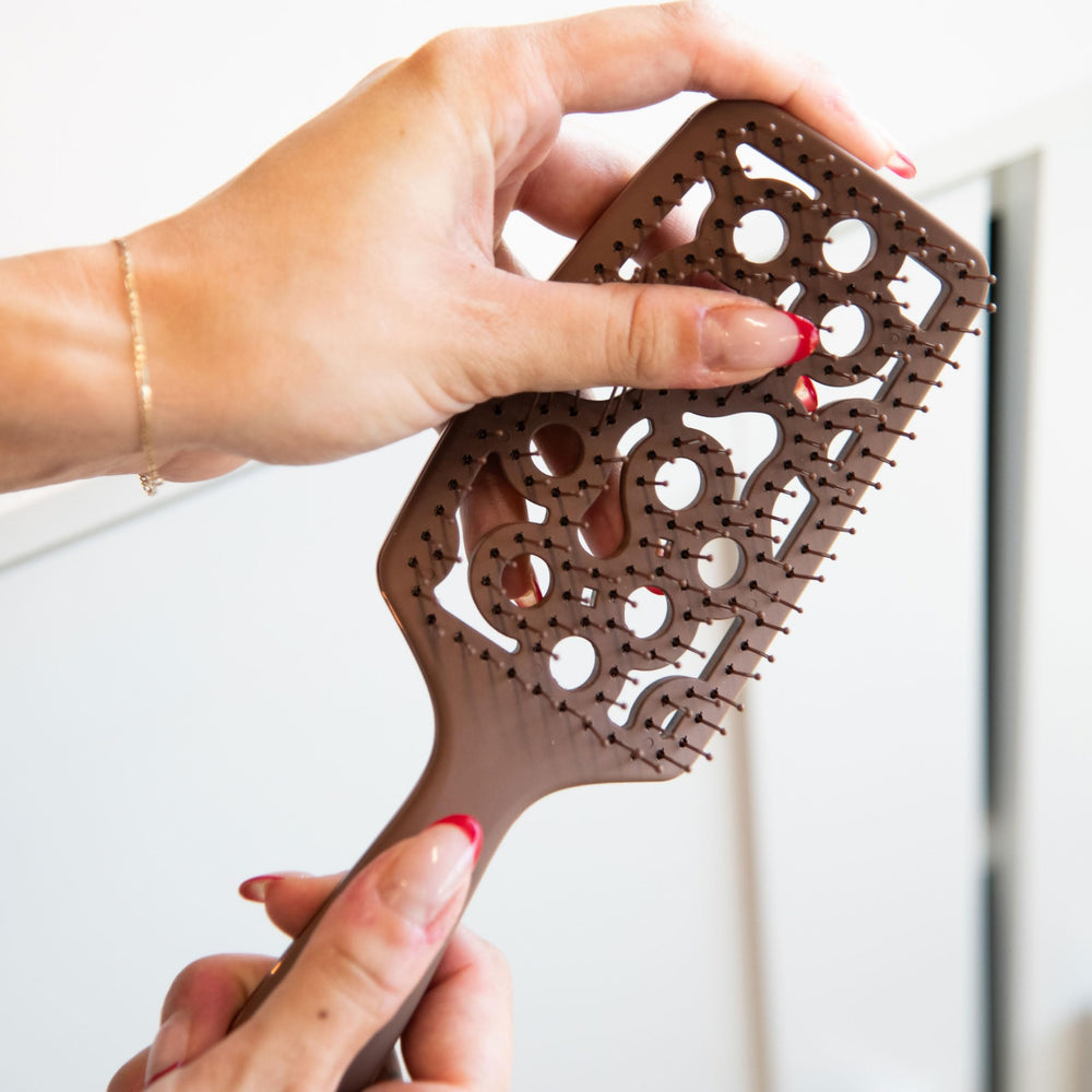 FRAMAR soft plastic bristles glide through tangles with gentle scalp massage.