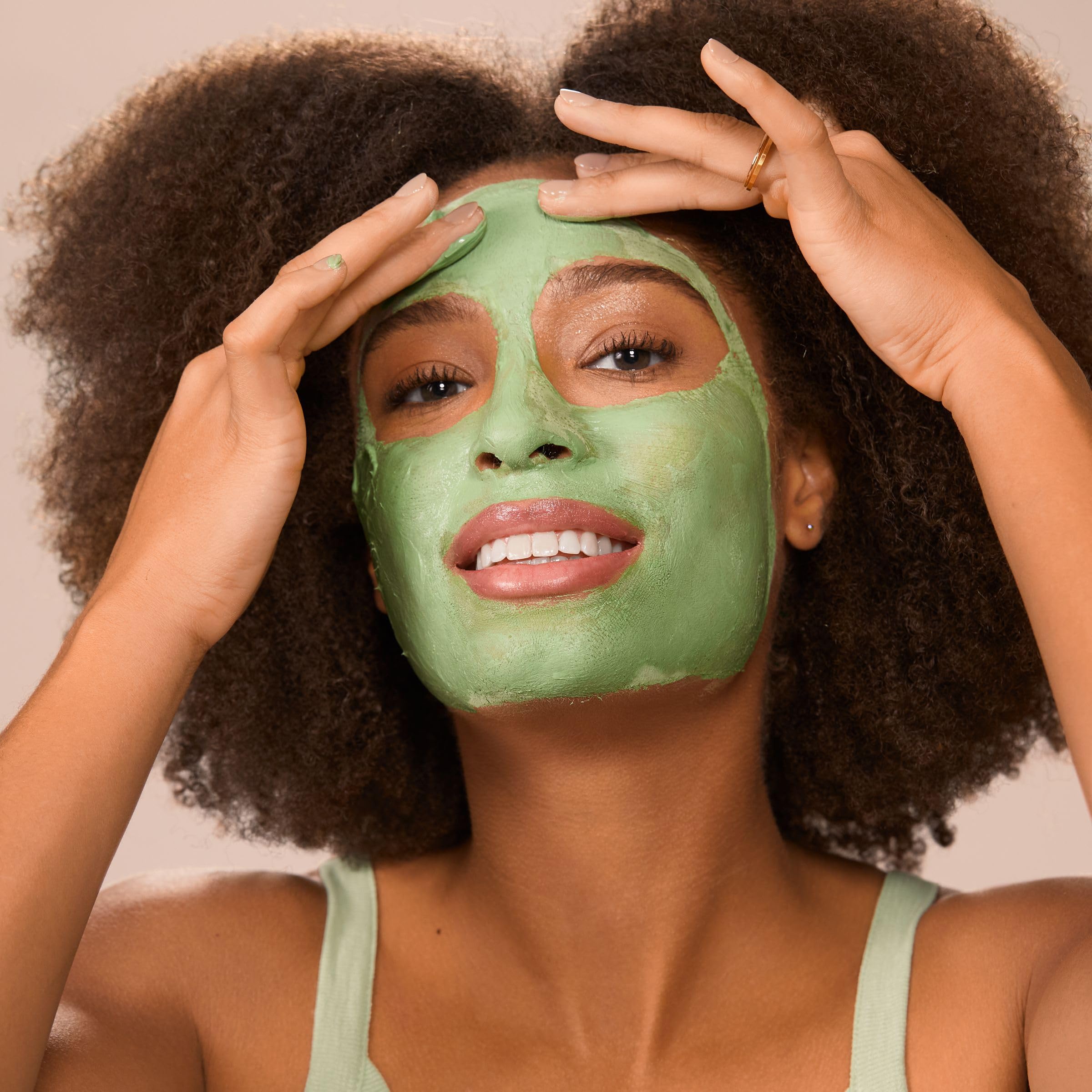 Rinsing Freeman Matcha Mask with warm water to reveal a refreshed complexion