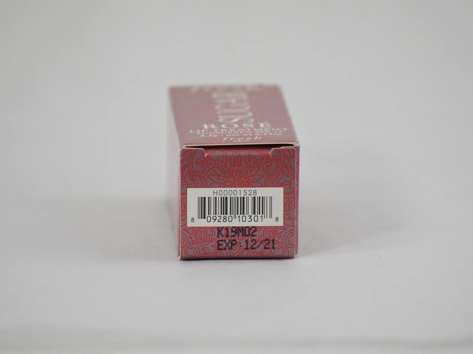 Label detail showing Rose shade and product size for Fresh Sugar Lip Treatment.