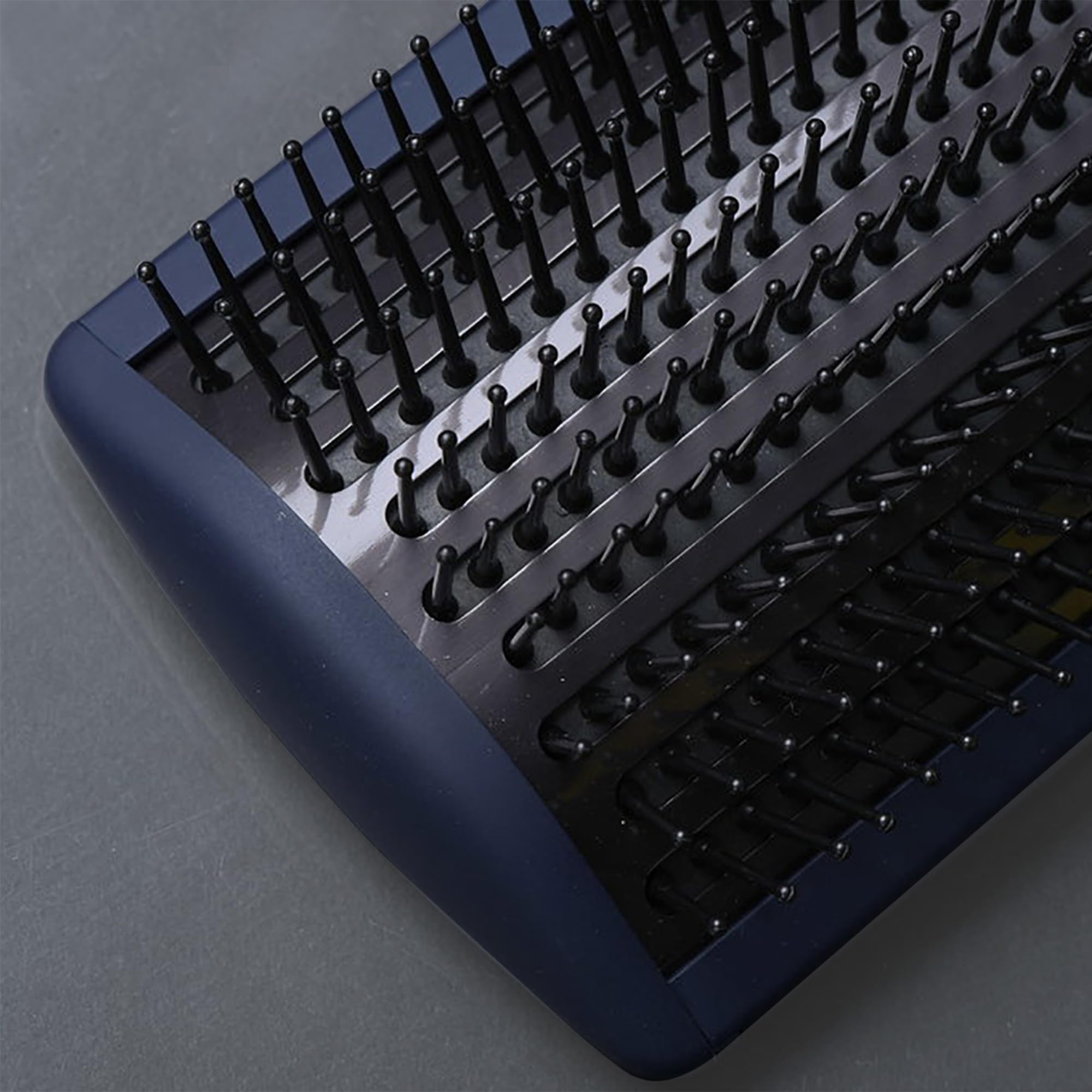 Fromm Intuition paddle brush demonstrating full-size coverage for larger hair sections.