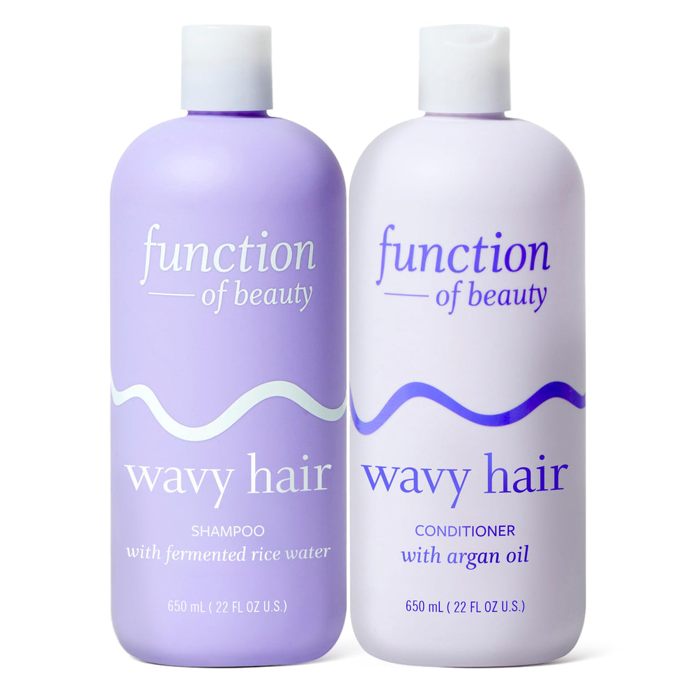 Function of Beauty Wavy Shampoo bottle pouring for lightweight cleansing and defined waves
