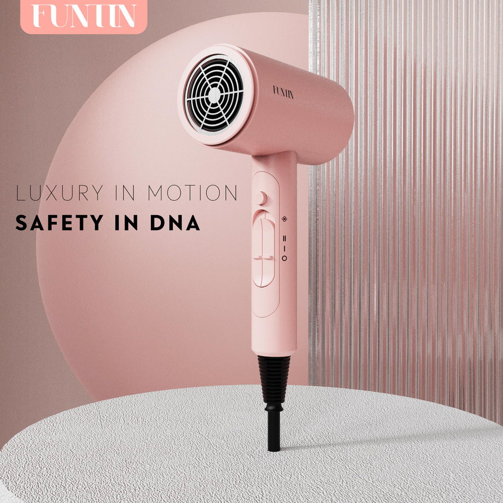 FUNTIN foldable stand shown with dryer in baby pink for neat storage
