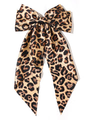 Furling Pompoms leopard satin bow camel close-up highlighting premium material and bold pattern.