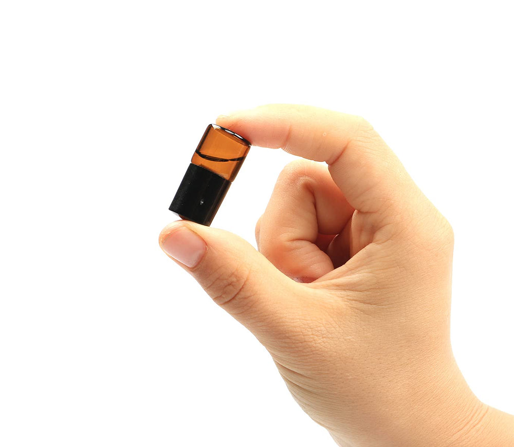Furnido black cap mini-vials keep oils secure during travel.