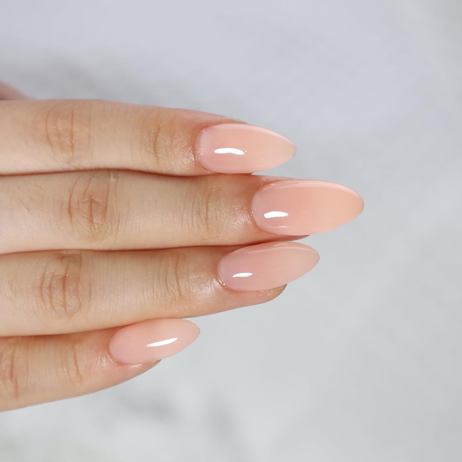 FZANEST nail repair gel base swatch illustrating surface smoothing.