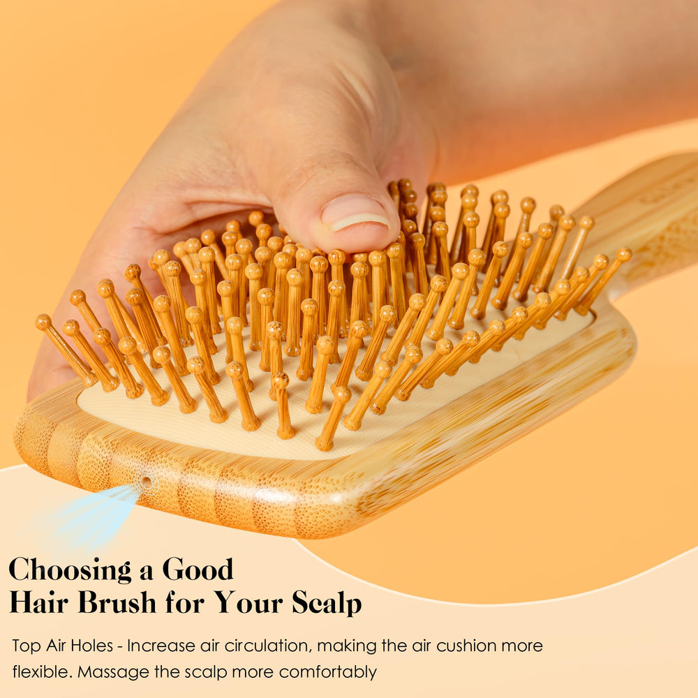 GAINWELL bamboo brush with rounded bristles detangles hair smoothly.