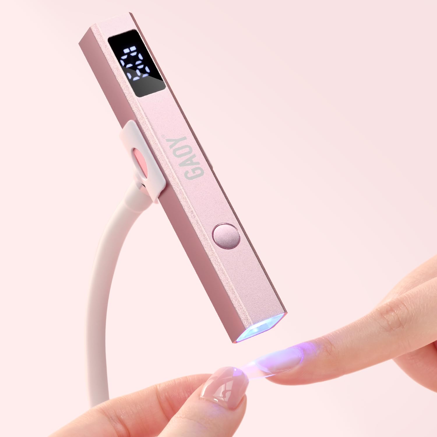 GAOY cordless nail lamp with stand viewed on a vanity for convenient home manicures and even curing.