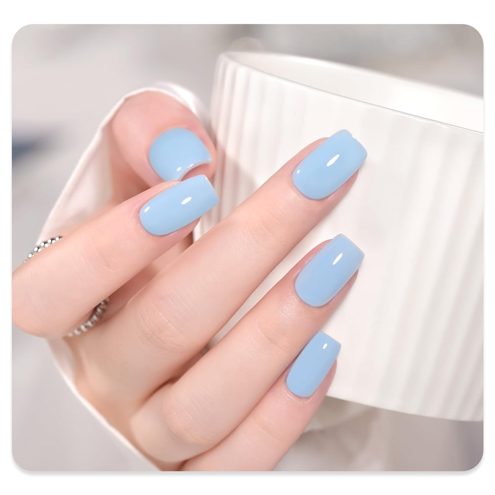 GAOY Light Blue Gel Nail Polish under UV lamp, quick 60-second cure for drying.