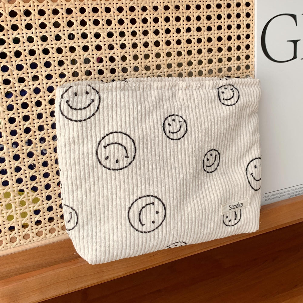 Compact 25 cm by 18 cm pouch that fits in purses and totes.
