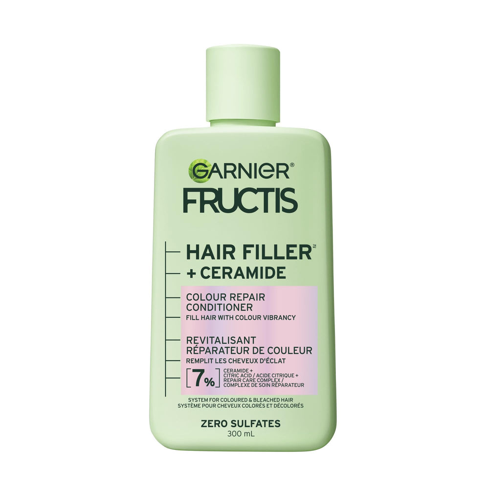 Garnier Fructis Hair Filler Ceramide conditioner bottle pour for vibrant color