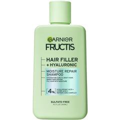 Garnier Fructis Relleno Capilar champú, botella visible, hidratacion profunda para rizos.