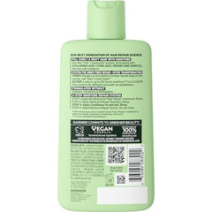Garnier Fructis Relleno Capilar: aplicador distribuyendo producto en cabello húmedo