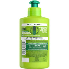 Garnier Fructis Sleek & Shine leave-in application demonstrates easy smoothing.