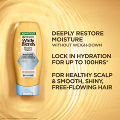Garnier Honey Water conditioner pour ready to distribute hydration through dry hair.