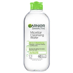 Garnier Micellar Water bottle pouring for quick all-in-one cleansing.