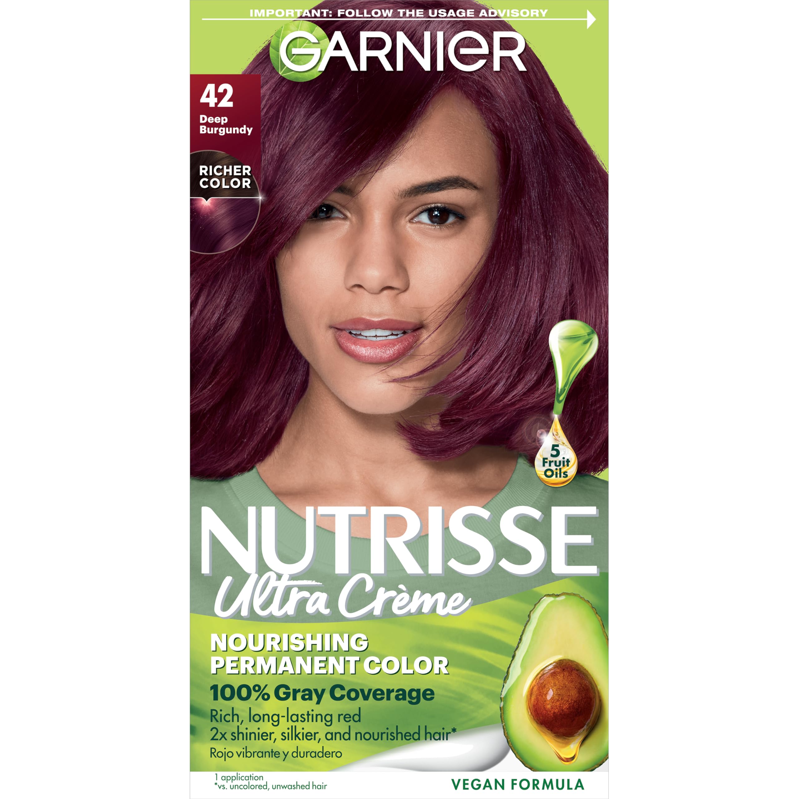 Garnier Nutrisse Ultra Creme bottle close-up shows nourishing oils for color preparation