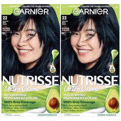 Garnier Nutrisse Ultra Creme colorant bottle in blue-black shade for vibrant, long-lasting color.