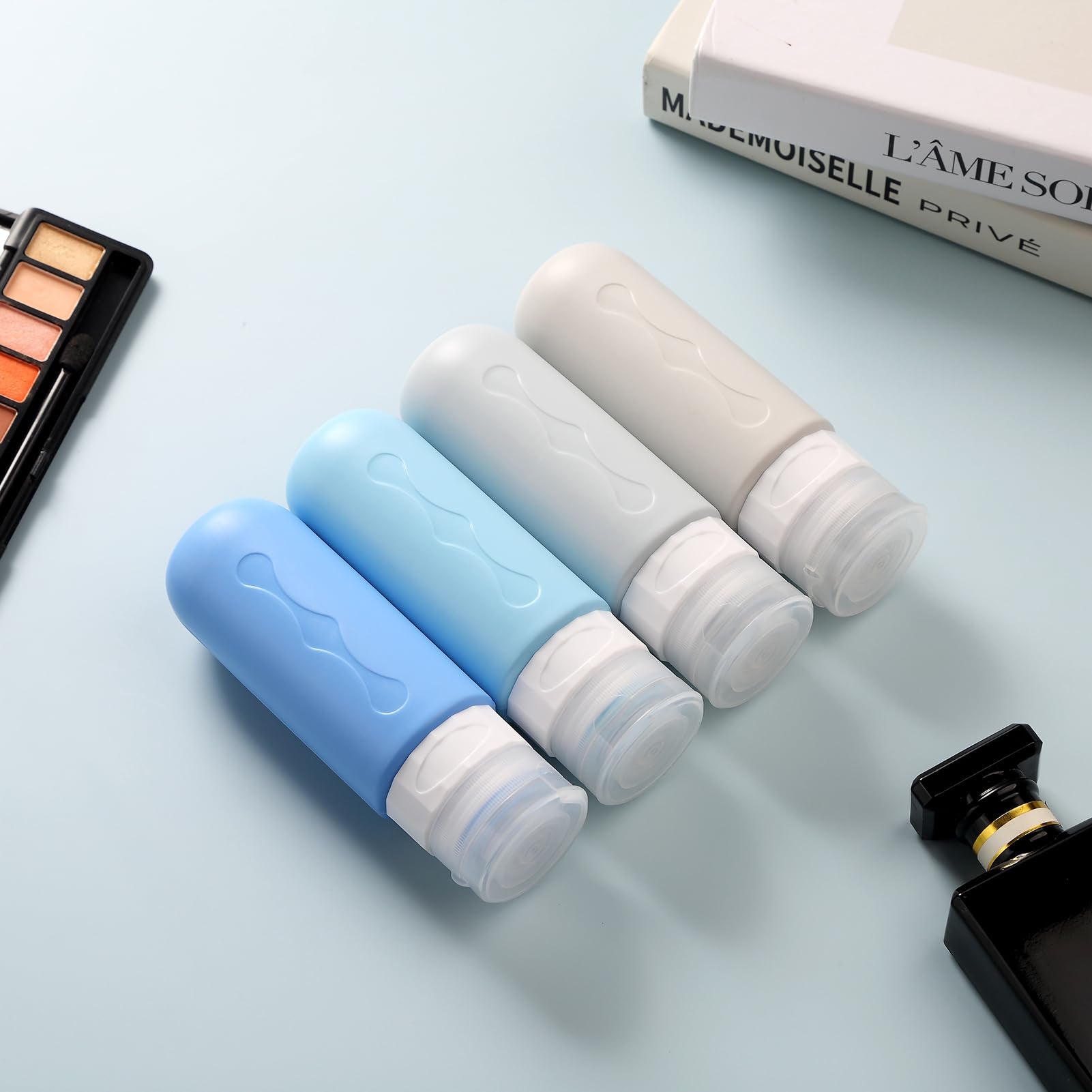 Gemice compact bottles fit in luggage pockets for organized packing.
