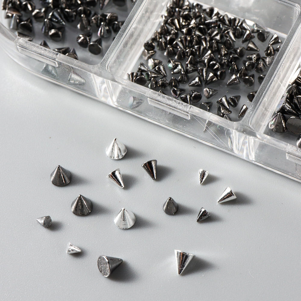Generic punk cone studs add dramatic texture to natural or acrylic nails.
