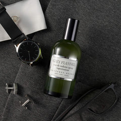 Geoffrey Beene Grey Flannel bottle with orange and lemon notes, refreshing daytime vibe.