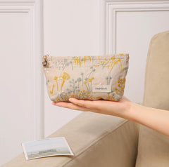 Getgto embroidery detail on two-pack makeup bags enhances everyday use.