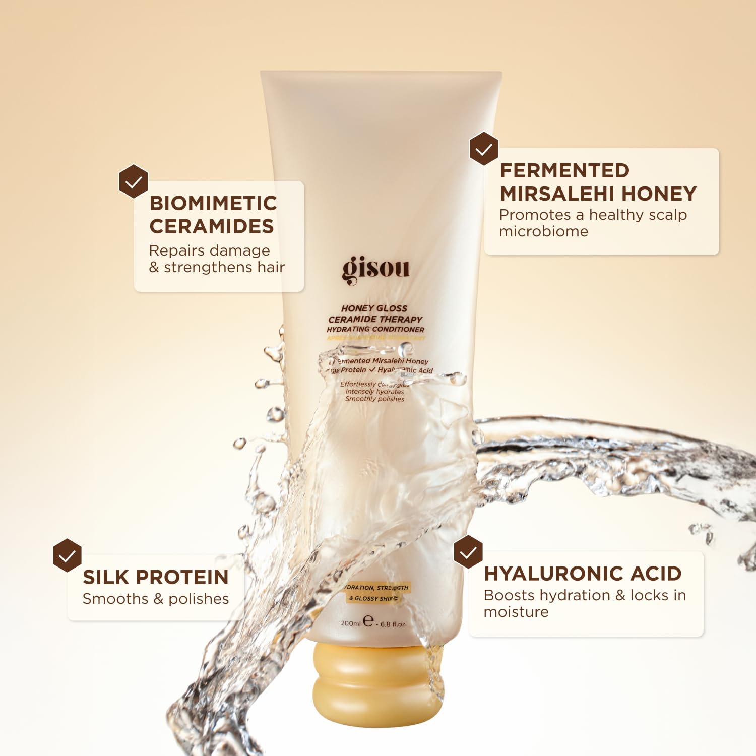 Gisou conditioner being dispensed from a pump for easy application and detangling prep.