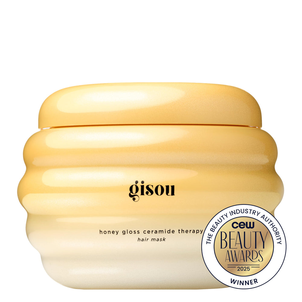 Gisou Honey Gloss Ceramide Therapy Mask being applied to lengths supports nourishment and smooth ends.